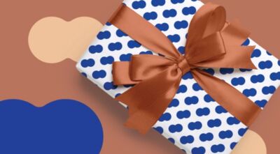 beeld van een cadeau met strik in de huiskleuren van Theater aan de Parade